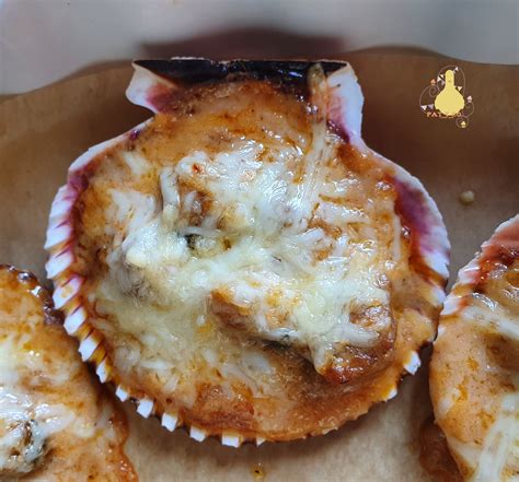Zamburiñas gratinadas con bechamel y queso
