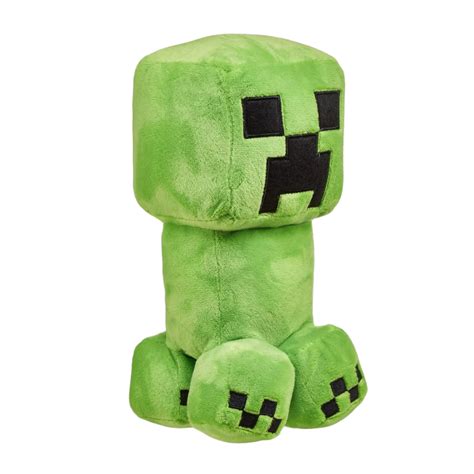 Streamer de Minecraft con un peluche Creeper en su setup