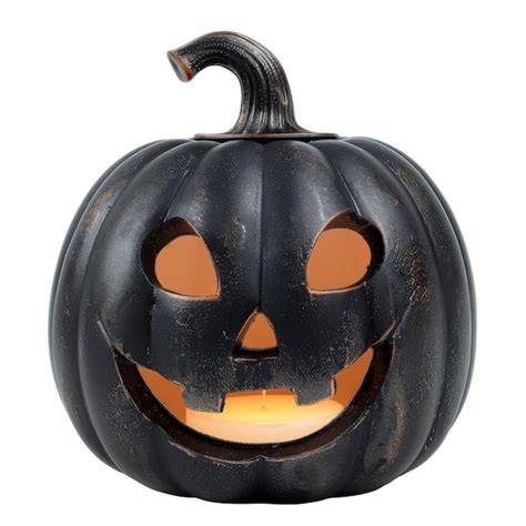 Calabaza de Halloween con vela encendida en el interior