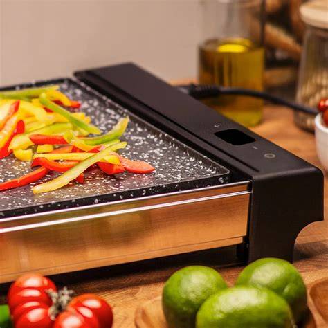 Plancha de asar Jata en funcionamiento cocinando verduras