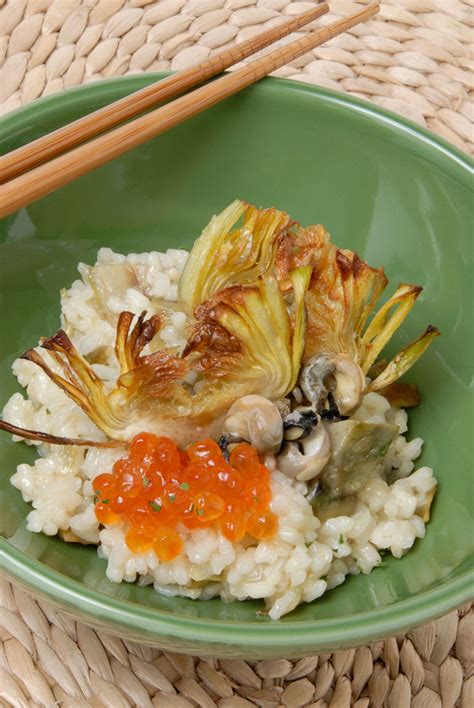 Plato de arroz con bígaros y alcachofas