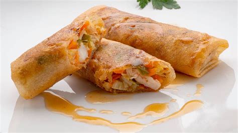 Gambones enrollados en obleas de rollitos de primavera