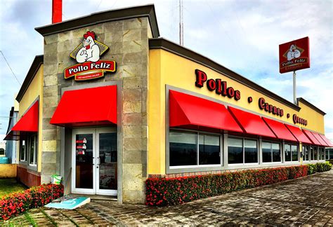 Fachada de un restaurante de pollo al carbón en Los Bermejales, Sevilla