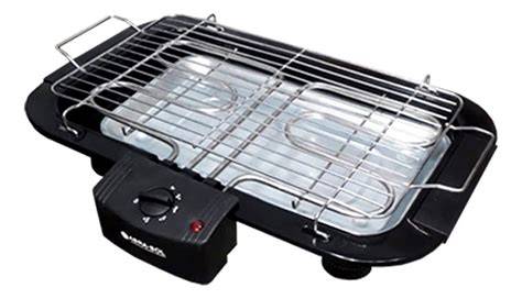 Parrilla eléctrica con regulador de temperatura en funcionamiento