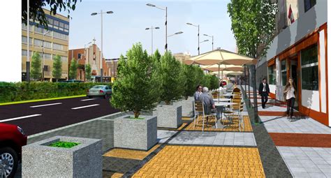 Bulevar peatonal con áreas verdes en un centro comercial