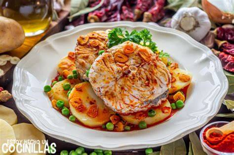 Merluza asada con patatas al pimentón