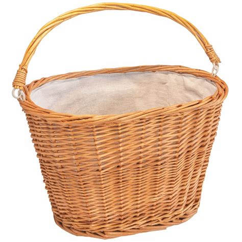Cesta de mimbre y timbre clásico en bicicleta