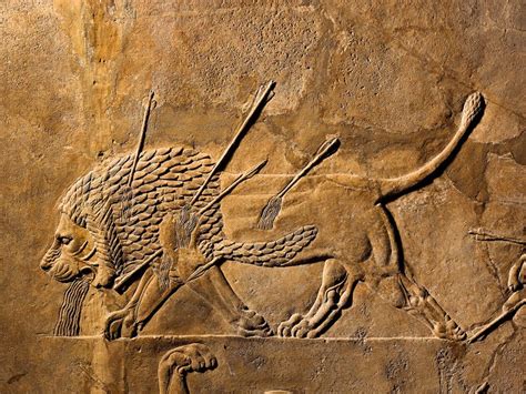 Arte asirio que representa la caza de leones