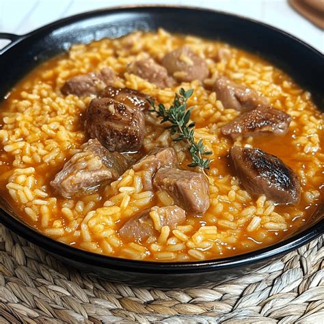 Arroz meloso con caldo de costillas