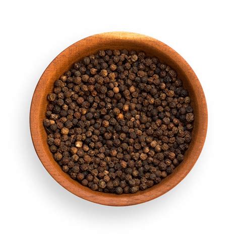 Pimienta negra en grano y hojas de laurel