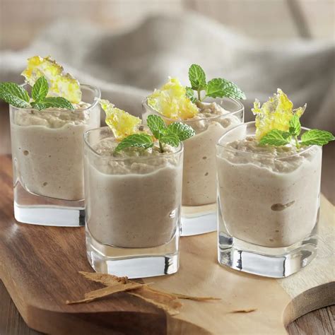 Vasitos de quesada con naranja caramelizada