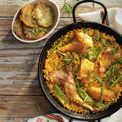Paella con pollo y conejo
