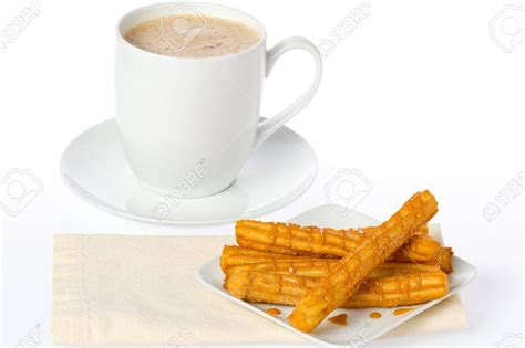 Plato de churros con una taza de café
