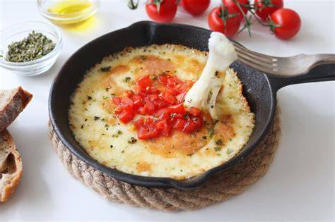 Provoleta con aderezos y acompañamientos