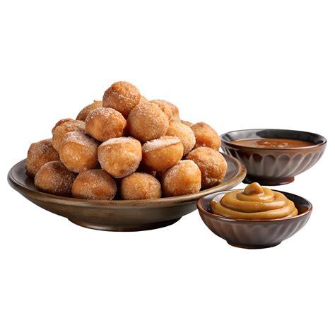 Plato de buñuelos recién hechos con azúcar espolvoreado