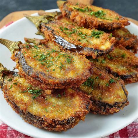Berenjenas empanizadas fritas y doradas