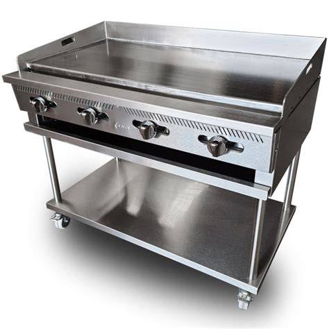 Plancha de acero inoxidable profesional sobre barbacoa