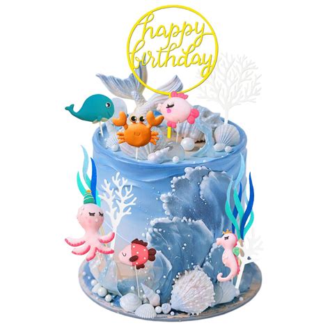 Tarta de animales marinos con fondant azul y decoraciones de criaturas marinas