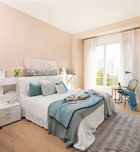 Dormitorio con ropa de cama y textiles en azul pastel
