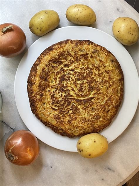 Discos de patata y cebolla pochados