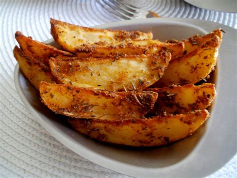 Patatas especiadas horneándose