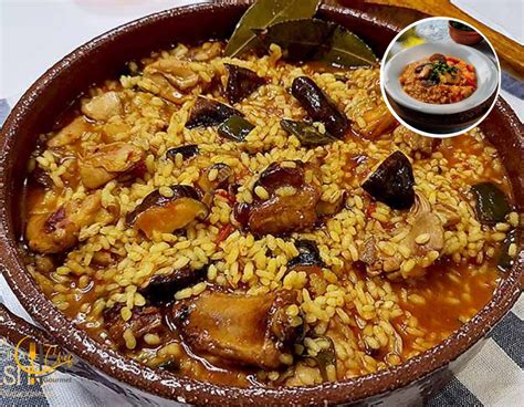 Cazuela de arroz brut terminada con un acompañamiento de vino tinto mallorquín