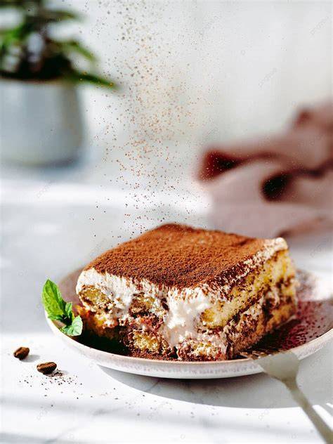 Imagen de un Tiramisú con cacao espolvoreado.