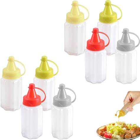 Variedad de recipientes para salsas, desde botellas exprimibles hasta tarrinas individuales