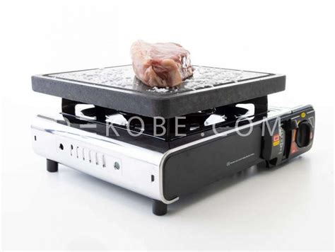 Conjunto de piedra volcánica con cocina de gas portátil