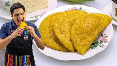 Proceso de armado de empanadas de plátano verde con queso