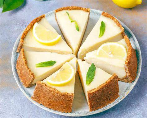 Ingredientes para tarta de limón: galletas, mantequilla, queso crema, nata, azúcar, limones