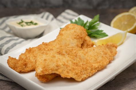 Potón rebozado con limón y perejil