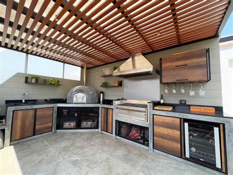 Barbacoa de doble uso con zona de parrilla y soporte para paella
