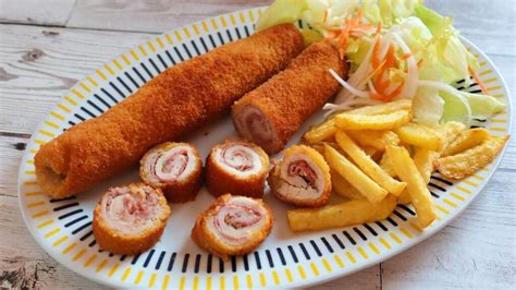 Flamenquines fritos en una sartén