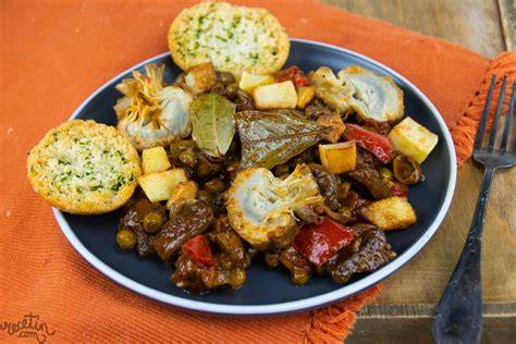 Presentación final de un plato de asadurilla con guarnición