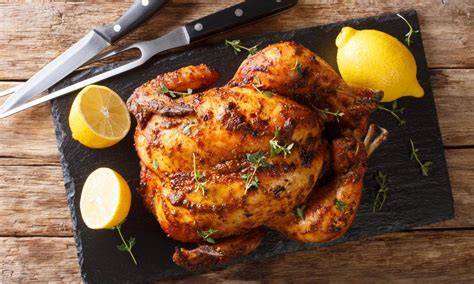 Preparación de pollo al horno con cítricos