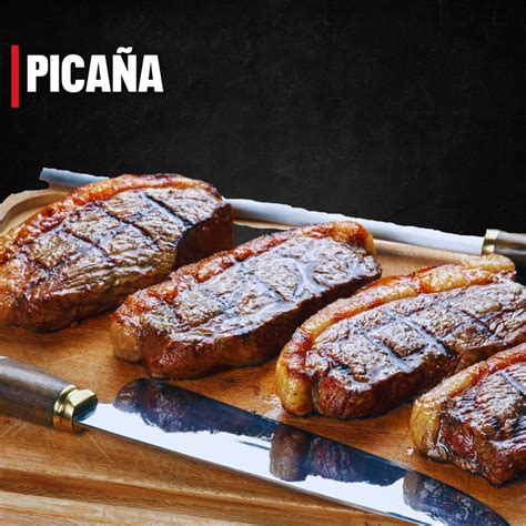 Imagen de una picaña cocinándose en una piedra volcánica