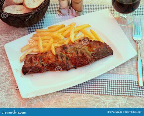 Plato de churrasco con patatas